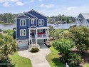 This modern luxury home offers a spectacular waterfront for sale in Southport North Carolina Brunswick County County on GolfHomes.com