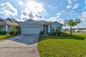 Discover this stunning lake-view home on a spacious corner lot! for sale in Bunnell Florida Flagler County County on GolfHomes.com