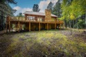 What a super cabin in the woods!  This custom home is on over an for sale in Angel Fire New Mexico Colfax County County on GolfHomes.com