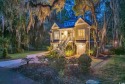 Nestled under a canopy of centuries old Angel Live Oak trees for sale in Pawleys Island South Carolina Georgetown County County on GolfHomes.com