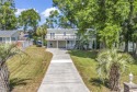 Nestled in the heart of Cherry Grove Beach, this charming home for sale in North Myrtle Beach South Carolina Horry County County on GolfHomes.com
