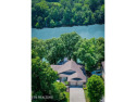 This lovely lakefront home located in a quiet cove, is nestled for sale in Loudon Tennessee Loudon County County on GolfHomes.com