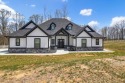Nestled within the verdant embrace of Tennessee's picturesque for sale in South Pittsburg Tennessee Marion County County on GolfHomes.com