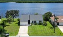 This waterfront home places the PEACE RIVER RIGHT IN YOUR BACK for sale in Punta Gorda Florida Charlotte County County on GolfHomes.com