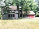 What a great wooded setting for this 3 BR & 3 BA 2200 + sg ft for sale in Canadian Lakes Michigan Mecosta County County on GolfHomes.com