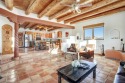 Discover the perfect blend of Southwestern charm and modern for sale in Ranchos de Taos New Mexico Taos County County on GolfHomes.com