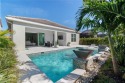 Welcome to this beautifully designed 3-bedroom plus den, 2 for sale in Naples Florida Collier County County on GolfHomes.com