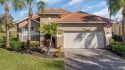 Charming inside and out, this larger home features neutral decor for sale in Lehigh Acres Florida Lee County County on GolfHomes.com