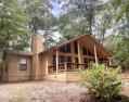 Situated on a hill, this one owner, two lot home allows for the for sale in Holly Lake Ranch Texas Wood County County on GolfHomes.com