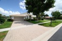 This stunning residence features 3 spacious bedrooms and 3 full for sale in Boynton Beach Florida Palm Beach County County on GolfHomes.com