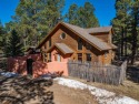 Surrounded within a serene grove of mature pine trees, this for sale in Angel Fire New Mexico Colfax County County on GolfHomes.com