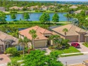 EXCEPTIONAL 2 BEDROOM + DEN, 2 BATH, 2-CAR GARAGE LAKEFRONT POOL for sale in Port Charlotte Florida Charlotte County County on GolfHomes.com