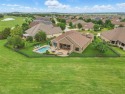 Situated directly on the 5th green, this luxury residence offers for sale in Denton Texas Denton County County on GolfHomes.com