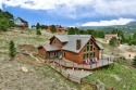 This mountain home boasts breathtaking mountain and golf course for sale in Angel Fire New Mexico Colfax County County on GolfHomes.com