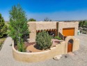 Get ready for Taos Country Club living with this spectacular for sale in Ranchos de Taos New Mexico Taos County County on GolfHomes.com