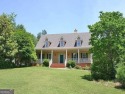 PRICE IMPROVEMENT on this charming 5 bedroom/4.5 bath Cape for sale in Snellville Georgia Gwinnett County County on GolfHomes.com