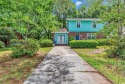 LOCATION is everything!  This spacious, four bedroom, two and a for sale in Surfside Beach South Carolina Horry County County on GolfHomes.com