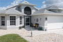 Exquisite property anchoring a quiet cul de sac with water and for sale in North Fort Myers Florida Lee County County on GolfHomes.com
