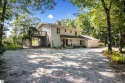 Welcome to a completely updated and enchanting 4-bedroom, 4-bath for sale in Cedar Michigan Leelanau County County on GolfHomes.com