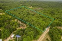 If you are looking for privacy and a beautifully wooded setting for sale in Beulah Michigan Benzie County County on GolfHomes.com