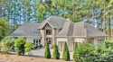 Nestled within the prestigious Uwharrie Point community, this for sale in New London North Carolina Montgomery County County on GolfHomes.com