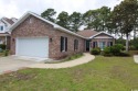 This sturdy brick home backs up to an expansive stretch of the for sale in Myrtle Beach South Carolina Horry County County on GolfHomes.com