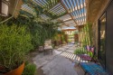 Enter through a lushly landscape covered courtyard, which has for sale in Rancho Mirage California Riverside County County on GolfHomes.com