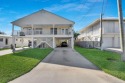 Stilted half duplex, in excellent condition and well maintained for sale in Key Colony Beach Florida Monroe County County on GolfHomes.com