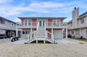 Welcome to 25 Newport Street, a breathtaking coastal retreat for sale in Ocean Isle Beach North Carolina Brunswick County County on GolfHomes.com