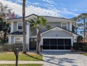 Enjoy this Beautiful two-story pool home, in the private and for sale in Palm Coast Florida Flagler County County on GolfHomes.com