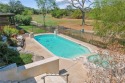 BEAUTIFUL ONE STORY  WITH POOL in Traditions with views the 5th for sale in Bryan Texas Brazos County County on GolfHomes.com