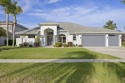 Discover Florida living in this beautifully renovated home for sale in Merritt Island Florida Brevard County County on GolfHomes.com