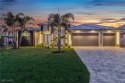 This stunning new construction home offers the perfect blend of for sale in Cape Coral Florida Lee County County on GolfHomes.com