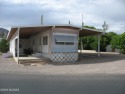 Well cared for single wide with large brick constructed added on for sale in Tucson Arizona Pima County County on GolfHomes.com