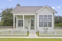 Located in the highly sought-after golf cart district of for sale in Ocean Springs Mississippi Jackson County County on GolfHomes.com