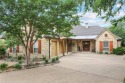 Nestled on a spacious 0.58-acre lot near the Traditions Club for sale in Bryan Texas Brazos County County on GolfHomes.com