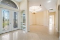 Discover this GORGEOUS 2,600+ Sqft home tucked away in a for sale in Lehigh Acres Florida Lee County County on GolfHomes.com