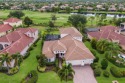 This gorgeous custom Lee Wetherington home is poised on one of for sale in Lakewood Ranch Florida Manatee County County on GolfHomes.com