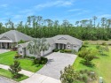 Enjoy peaceful water and wooded views in this beautifully for sale in New Smyrna Beach Florida Volusia County County on GolfHomes.com