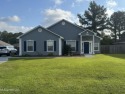Nestled near the scenic Hickory Hills Golf Course, this charming for sale in Gautier Mississippi Jackson County County on GolfHomes.com