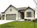 NEW CONSTRUCTION READY NOW! The award winning WINDSOR REVERSE 1 for sale in Overland Park Kansas Johnson County County on GolfHomes.com