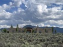 Situated on 6.77 acres spanning three independent parcels (two for sale in Ranchos de Taos New Mexico Taos County County on GolfHomes.com
