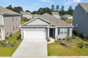 Welcome to your dream home! This stunning, nearly-new residence for sale in Longs South Carolina Horry County County on GolfHomes.com