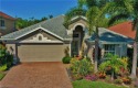 EXTENSIVE UPGRADES WITH THIS CYPRESS MODEL POOL HOME WITH A for sale in Fort Myers Florida Lee County County on GolfHomes.com