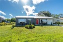 Absolutely Charming home nestled on a large fenced yard along a for sale in Port Charlotte Florida Charlotte County County on GolfHomes.com