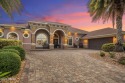 Welcome to 568 Luna Bella Lane, a luxurious lakefront estate for sale in New Smyrna Beach Florida Volusia County County on GolfHomes.com