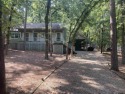 This one-owner home sits on three wooded lots for a total of .75, Texas