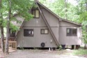 Private setting on lake Silveratta,  newer style custom chalet for sale in Innsbrook Missouri Warren County County on GolfHomes.com