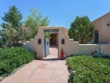This exceptional adobe-style home, with a stucco exterior and for sale in Ranchos de Taos New Mexico Taos County County on GolfHomes.com