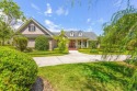 This all brick, custom home is situated on Lake Lachicotte for sale in Murrells Inlet South Carolina Georgetown County County on GolfHomes.com